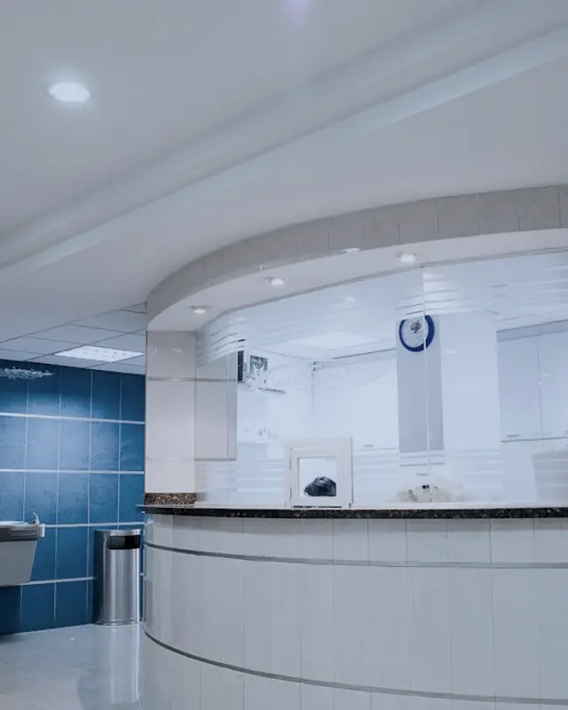 A bright, empty clinic reception desk